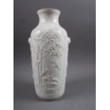 A Chinese blanc de chine vase with relief panels decorated with birds, trees and animals, 13" high