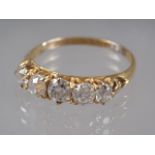 An 18ct gold and diamond five stone dress ring, size Q, 2.6g