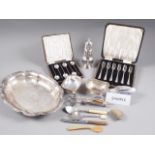 Three silver plated entree dishes and covers, a plated sugar dredger, cased plated cutlery and other