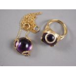 A yellow metal, diamond and amethyst coloured dress ring, size M, and a matching pendant, on chain