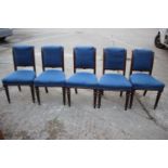 A set of five Victorian oak frame standard dining chairs, upholstered in a blue hopsack, on turned
