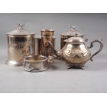 Three Omani engraved "biscuit" boxes and covers, and other silver plate