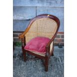 A child's 19th century mahogany frame caned tub-shape chair, on square taper supports