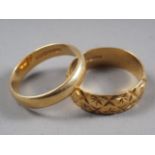 An 18ct gold wedding band, size S, and another size T, 10g