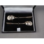 A pair of silver jockey cap and riding crop salt spoons, in case