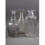 A 19th century three-ring necked decanter and stopper, a 19th century Gothic cut glass decanter