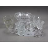 A collection of mostly clear pressed glass, including bowls, vases, drinking glasses, jugs and other