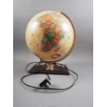 A Scan Globe Denmark "World Antique" 16" electrically lit globe, on mahogany base, fitted barometer,