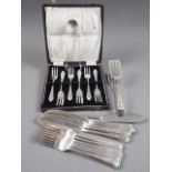 A pair of silver sugar tongs, 0.9oz approx, a pair of silver plated sandwich servers, a cased set of