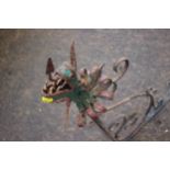 A wrought iron and painted dragon wall bracket for a hanging sign, 32" long