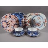 An 18th century Chinese export plate, a similar plate and other Oriental ceramics (chips and