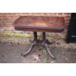 A 19th century mahogany fold-over top card table, on quadruple reeded columns and splay supports,