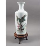A Chinese famille rose tapered vase with figures in a landscape decoration, 10 1/4" high, on
