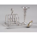 A silver four-division toast rack, 4.3oz troy approx, a Georgian sifter spoon, 1.4oz troy approx,
