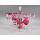 Five ruby glass and cut wines, three smaller similar glasses, a decanter and stopper