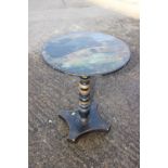 A painted and ebonised circular tilt top occasional table, on turned column and quatreform base, 17"