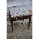 A mahogany dressing stool with drop-in needlepoint seat, on square taper supports, 18" wide x 16"