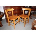 A pair of child's Scandinavian bar back panel seat chairs, on turned and stretchered supports
