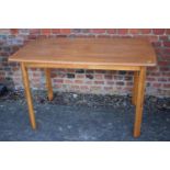 An ash shape top dining table, on splay supports, 47" wide x 29 1/2" deep x 29" high