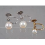 A pair of white gold and pearl earrings, and a similar 9ct yellow gold and pearl earring