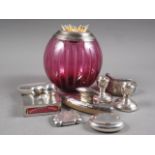 A silver hip flask, a white metal rimmed cranberry glass table vesta, 5" high, two silver vestas,