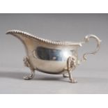 A Payne & Son silver gravy boat, on paw supports, 12.9oz troy approx