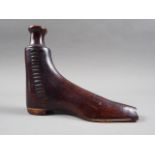 A 19th century "Rockingham" treacle glazed boot-shape flask, 6" high (minor chip to toe)
