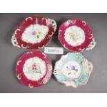 A 19th century bone china floral decorated part dessert service with ruby gilt borders and three