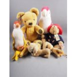 A Merrythought Teddy bear, a Paddington bear, two parrot soft toys and others