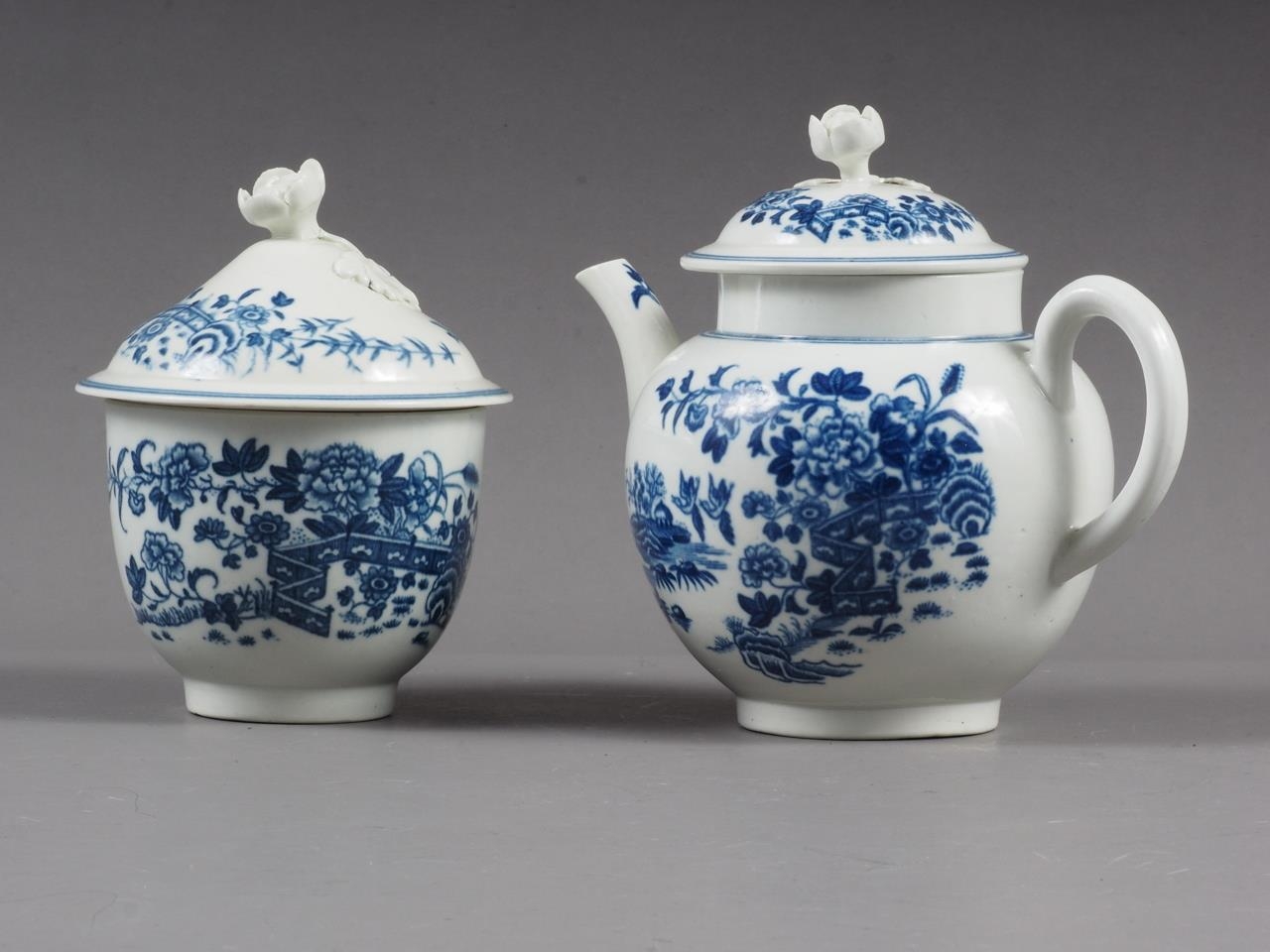 An 18th century Worcester blue and white "Chinese fence" pattern teapot and a similar lidded sucrier