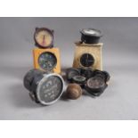 An altimeter, in oak case, and other aircraft instrument gauges