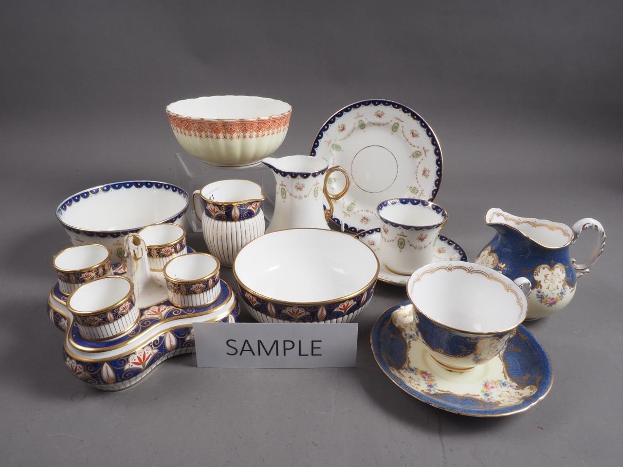 A Minton part dinner service with blue, gilt and floral decoration, a Royal Worcester part teaset