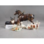 A Beswick model of a heavy horse, 10 1/2" high, and other similar models, a selection of Goss