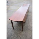 A well reproduced mahogany "wake" table, on moulded double supports, 122" long x 68" wide x 29 1/