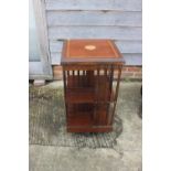 A mahogany and satinwood banded revolving bookcase, 18" square x 32" high