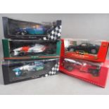 Four Formula One model racing cars, including a Pauls Model Art "Michael Schumacher Collection"
