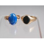 A 14k gold dress ring set polished lapis lazuli cabochon, size N/O, 4.2g, and a 9ct gold and