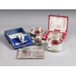 A silver ashtray, in fitted case, a silver egg cup and spoon set, in fitted case, 3oz troy approx