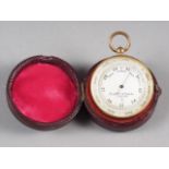 A Negretti & Zambra pocket barometer, in fitted leather case