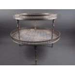 Two silver plated and engraved gallery edge trays, on turned supports, 23" dia and 18 1/2" dia