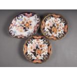 Seven Royal Crown Derby plates with Imari decoration and a similar shaped dish, 11" wide