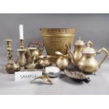A quantity of brassware, including a pair of 19th century brass candlesticks, 8 1/2" high, a four-