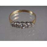 An 18ct gold, platinum and diamond illusion set five stone ring, size I, 1.7g gross,