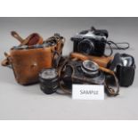 Two pairs of military binoculars, a folding telescope, various cameras and other items