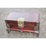 A Korean softwood and brass mounted coffer, fitted drawer, on cabriole stretchered supports, 32"