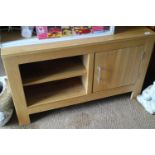 An oak television stand, fitted one door and open shelves, 41" wide x 21" deep x 24" high, and a