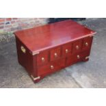 A mahogany low chest/coffee table, fitted five short and two long with brass bound carry handles,