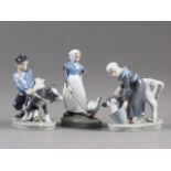 Three circa 1960s Royal Copenhagen figures, including a farmhand with cow, 6 1/2" high, and