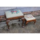 A carved walnut stool with needlepoint seat, on cabriole supports, a smaller similar stool, a