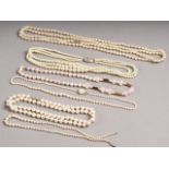 A graduated pearl necklace with 9ct white gold clasp, four other pearl necklaces and a pearl,
